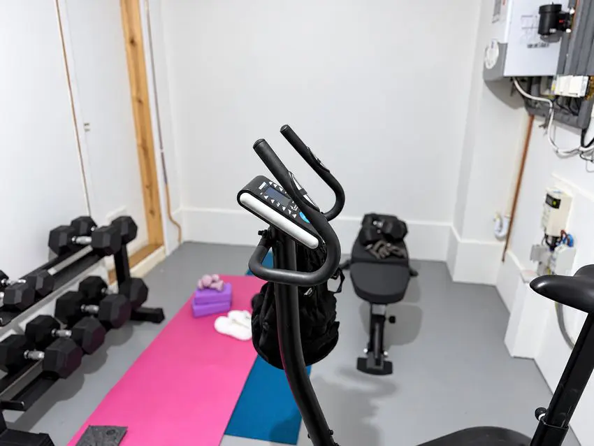 Half garage home gym with weights bench, yoga mats and exercise bike
