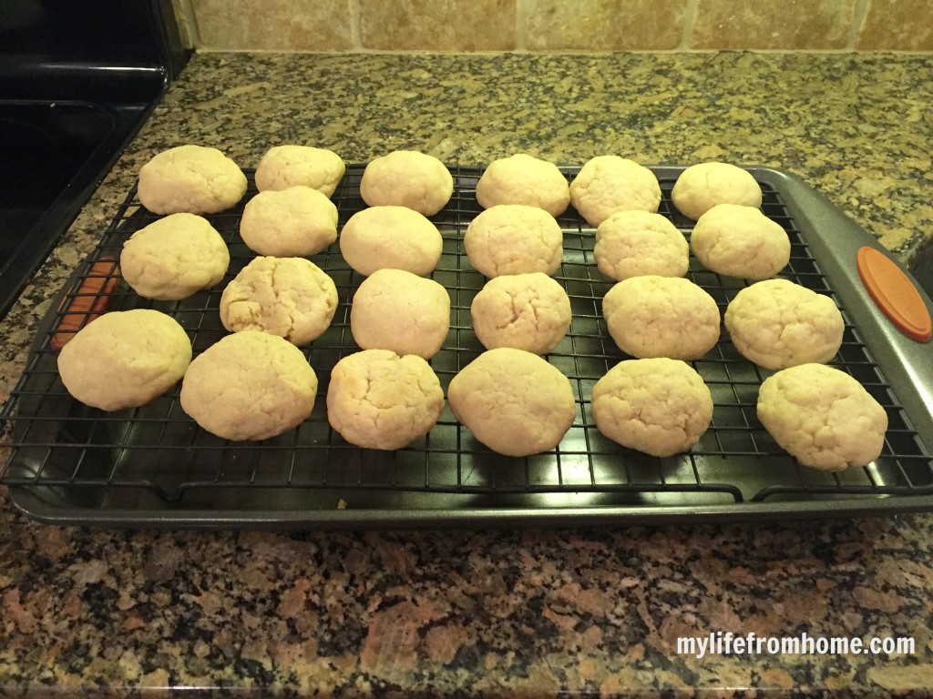 Baked vanilla scone cookies cooling on a wire rack before glazing