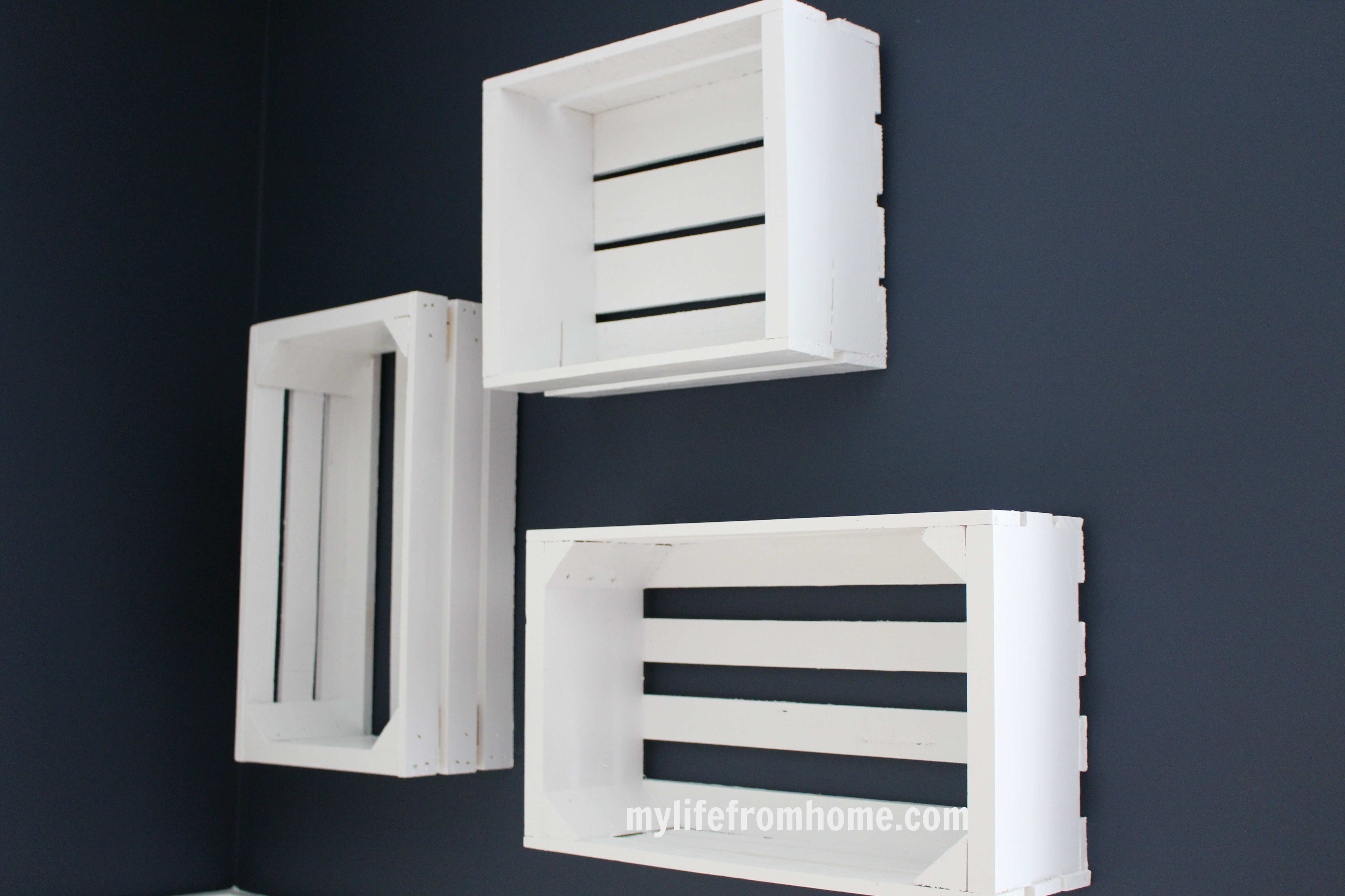 Hanging wall crates for displaying kids art projects by www.whitecottagehomeandliving.com