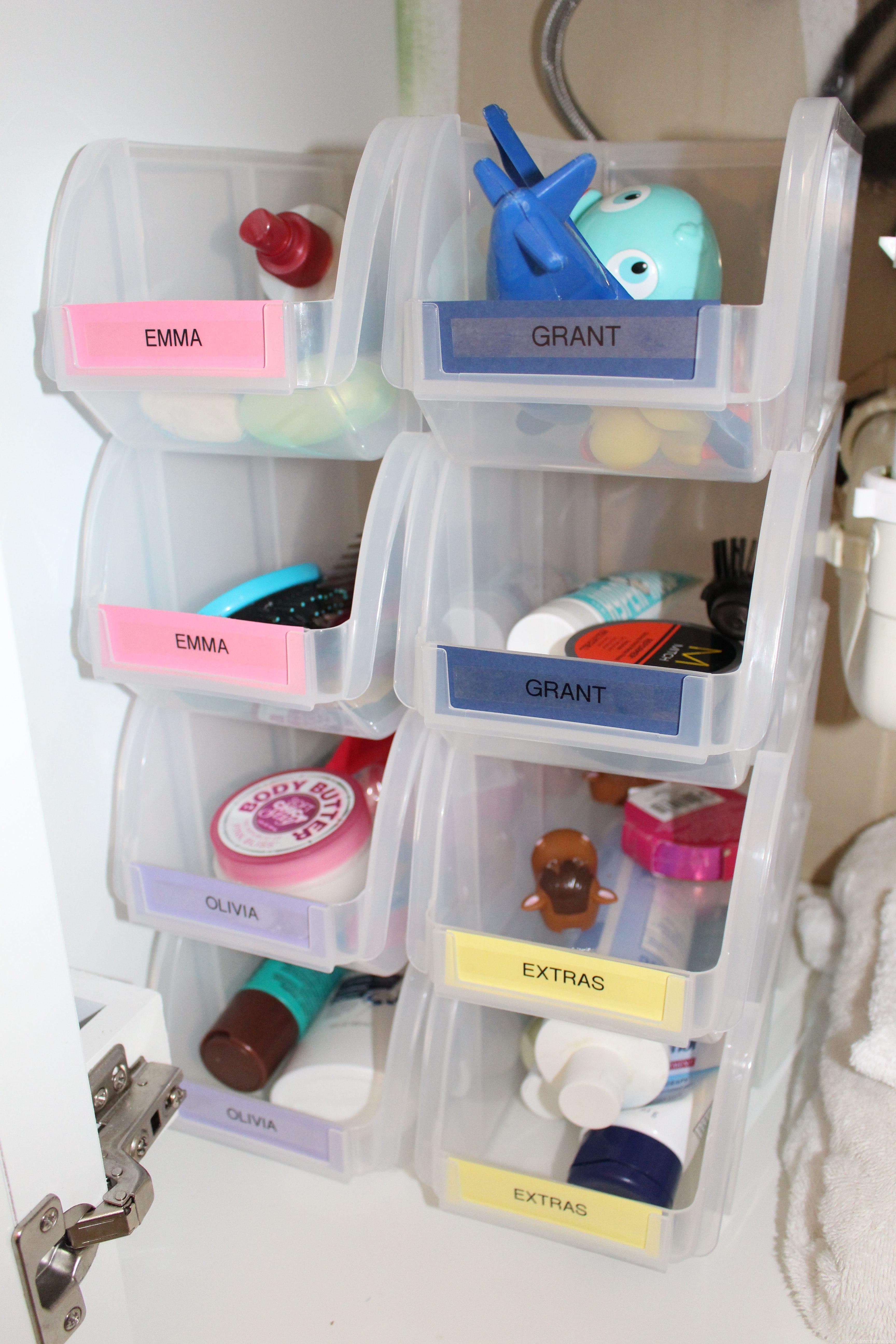 Labeled Bins for Small Bath Storage by www.whitecottagehomeandliving.com