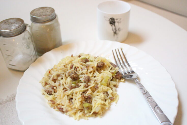 Sausage & Rice Casserole Served on a Plate at a Dining Table