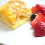 Close view of the pastry and egg layers in breakfast casserole