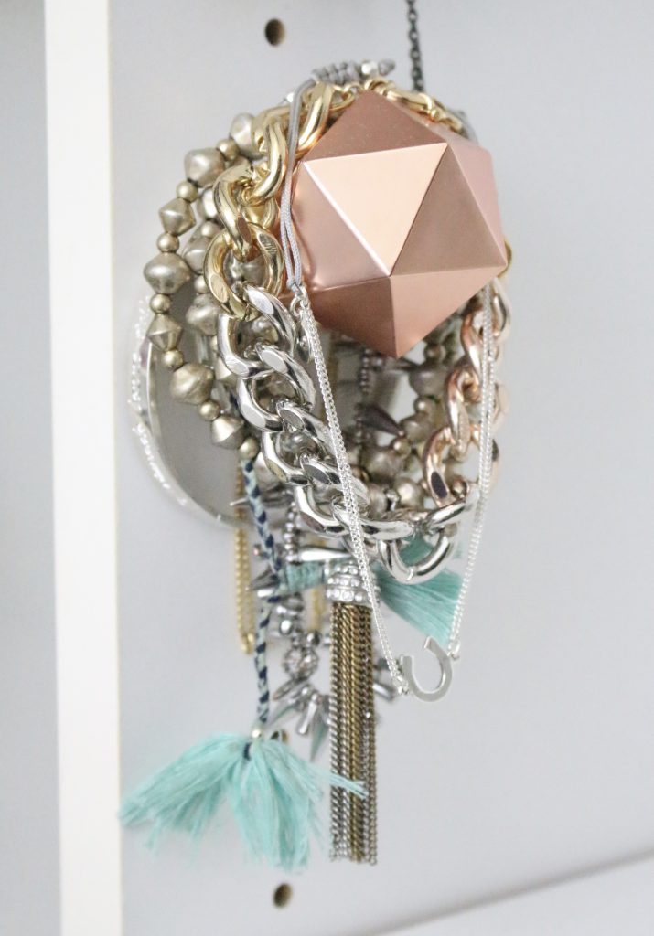 A full boutique closet reveal- master closet- closets- organizing closets- do it yourself- DIY- DIY projects- decoration ideas- room decor ideas- room design- home decor- closet decor- boutique- closet organization- shelf organization- walk in closet- jewelry storage- displaying jewelry in a closet- copper knobs