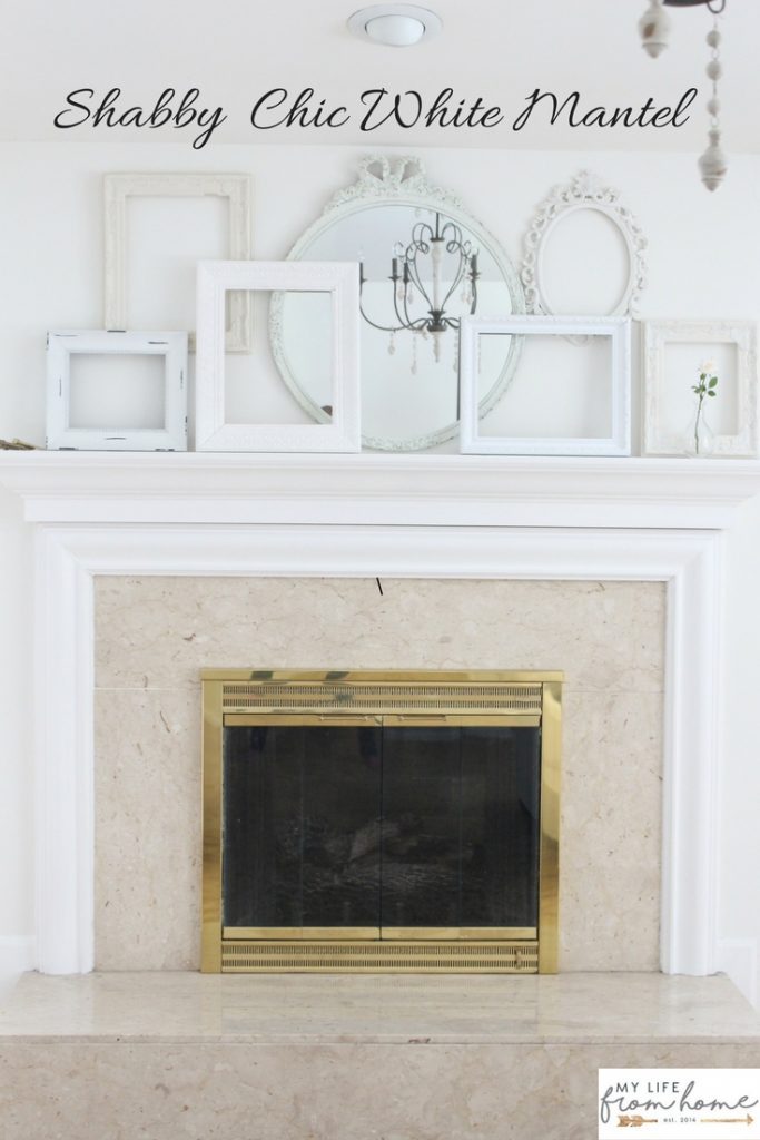A shabby chic white mantel- layered frames- white mirror- all white decor- romantic design- fireplace decor- mantel decor- home design- decor ideas- mantles- french country style mantel- DIY- Do it Yourself- DIY projects- room design- wall decorating ideas- gallery wall- room decor ideas- decoration ideas- farmhouse style chandelier- french country chandelier