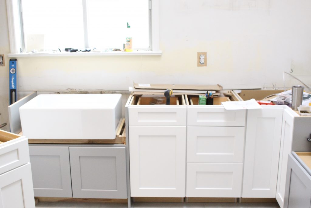 Warm and Inviting White Cottage Kitchen Renovation Update- Halfway mark of the kitchen reno- white and gray kitchen cabinets- home design- farmhouse sink- hutch- Woodmark- Home Depot cabinets- DIY- DIY projects- renovations- home design ideas