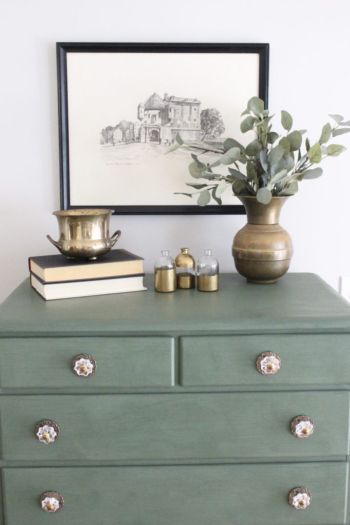 A wood dresser painted green- Amy Howard paints- One step paint- green- Cherbourg- how to use chalk paint- chalk painted finish- green furniture- how to paint furniture- home design- DIY- Do it Yourself project- painted furniture- gold and crystal knobs