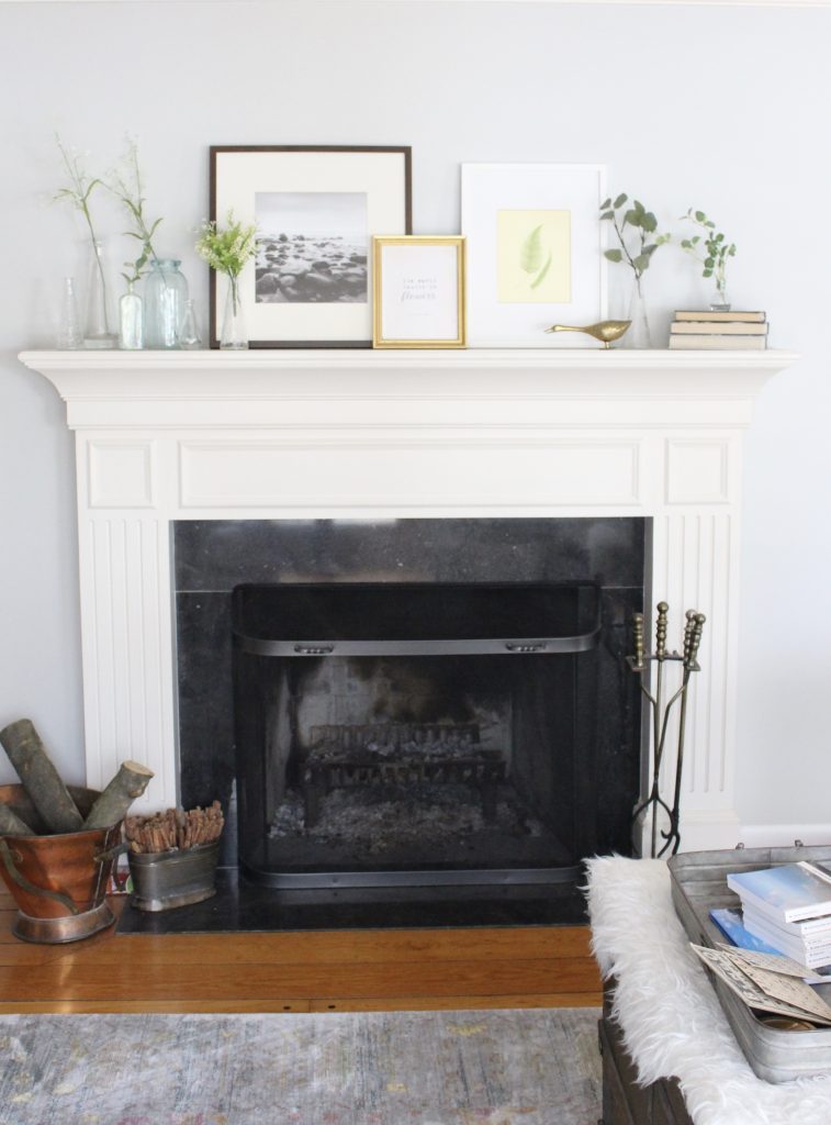 spring mantel decor- how to decorate your mantel for spring- mantles- mantel decorating- spring decor- fresh spring ideas- layered frames- wall decorating ideas- home design- diy- diy projects- seasonal mantel decor- fireplace mantel