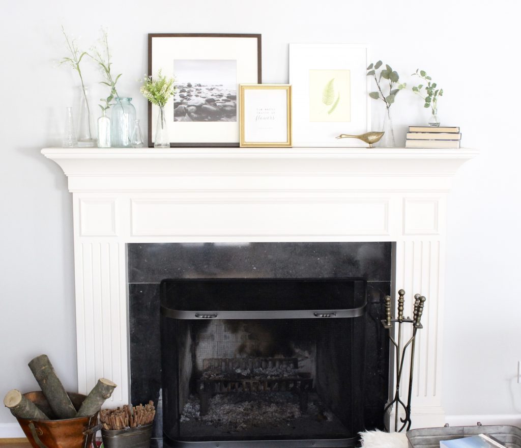spring mantel decor- how to decorate your mantel for spring- mantles- mantel decorating- spring decor- fresh spring ideas- layered frames- wall decorating ideas- home design- diy- diy projects- seasonal mantel decor- fireplace