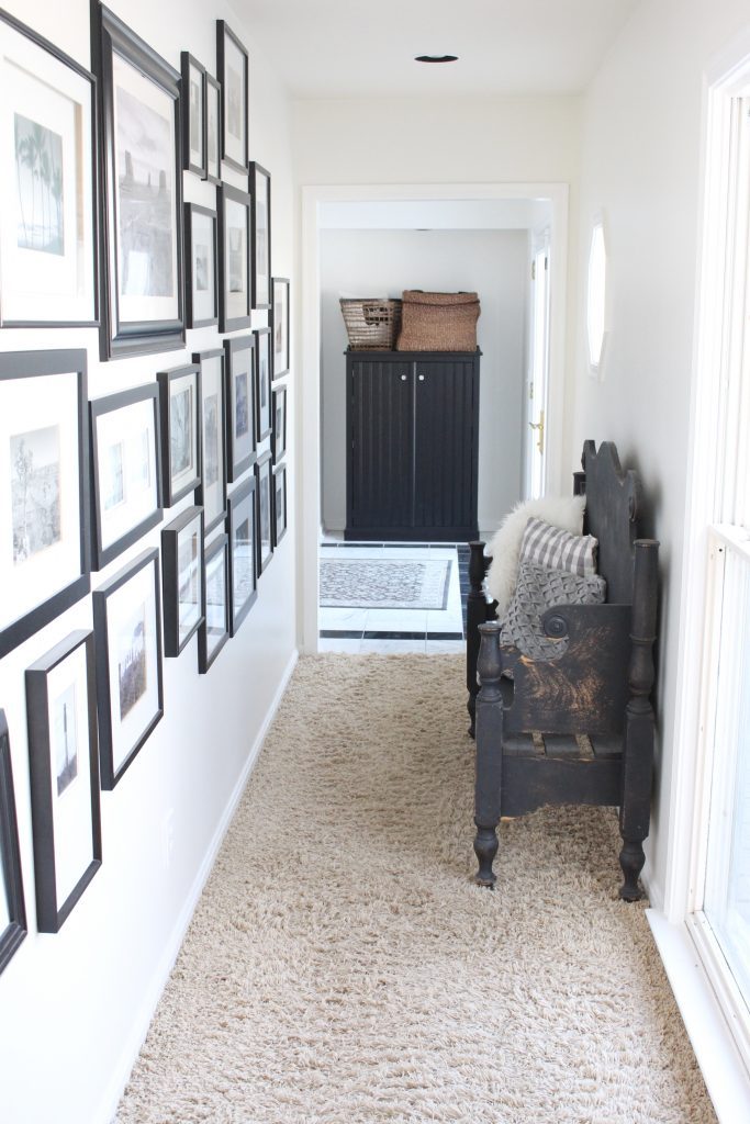 travel gallery- wall gallery- travel photos- how to display- hallway decorating- long hallway- decor- wall decor- black and white photographs- master suite