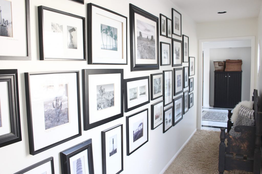 travel gallery- wall gallery- travel photos- how to display- hallway decorating- long hallway- decor- wall decor- black and white photographs- master suite- black framed pictures