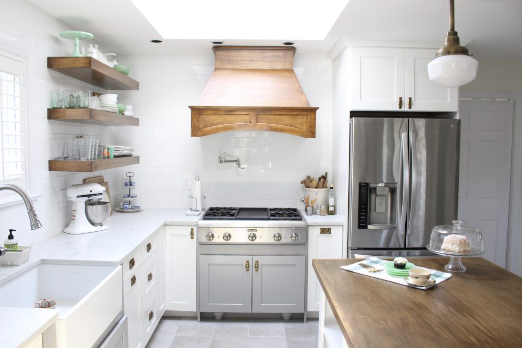Kitchen- remodel- makeover- cottage kitchen- farmhouse kitchen- mix and match cabinets- wood hood- professional appliances- open shelving- schoolhouse lights