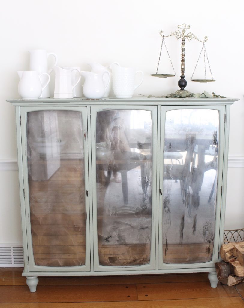 Hutch cabinet makeover- DIY- green- paint- cabinet- Do it Yourself projects- painted furniture- turning a hutch into a cabinet with legs- adding legs to furniture- dining room- furniture- storage piece- mirror spray paint- home decor- room design