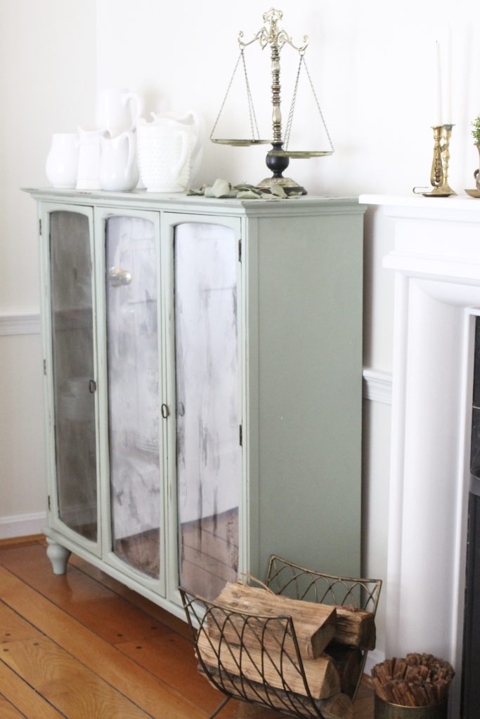 Hutch cabinet makeover- DIY- green- paint- cabinet- Do it Yourself projects- painted furniture- turning a hutch into a cabinet with legs- adding legs to furniture- dining room- furniture- storage piece- mirror spray paint- home decor- room design- green painted furniture