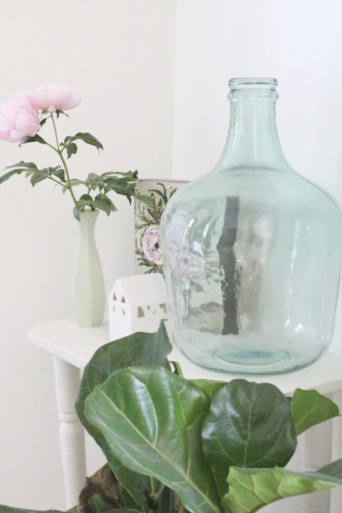 peony- flowers- gardening- vignette- how to - decorate- an entryway- entryway ideas- home decor- using flowers in decorating- faux milk glass- fiddle fig leaf- demijohn bottles- flower artwork- home design- painted furniture