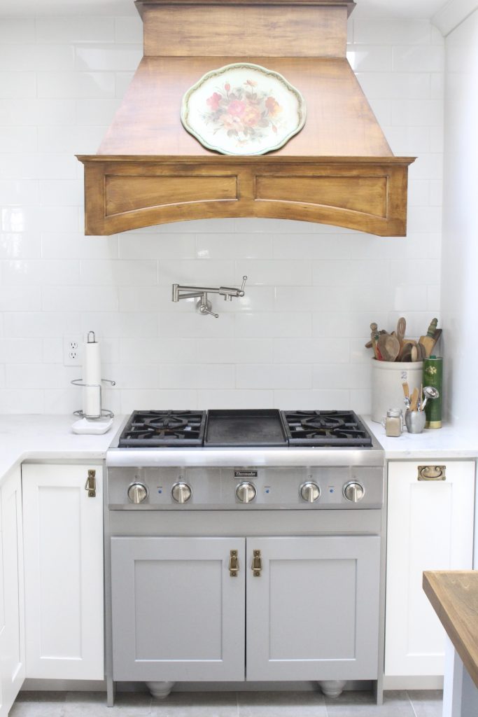 White Cottage Kitchen Renovation Reveal- kitchen renovation- remodel-kitchen reveal- cottage kitchen- white cabinets- wood range hood- vintage- painted- tray