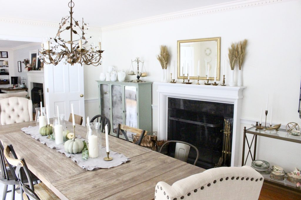 Simple neutral fall colors in our dining room- dining room- fall decor- neutral- living spaces- gold- brass- candlesticks-milk glass- fireplace decor mantel- decorating for fall- seasonal