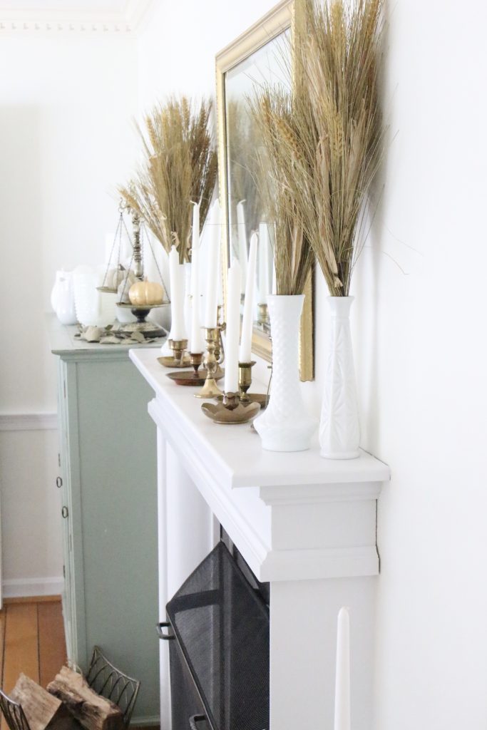 Fall mantel decor- simple- understated- wheat- milk glass- antique brass candlesticks- dining room decor- fall decorating