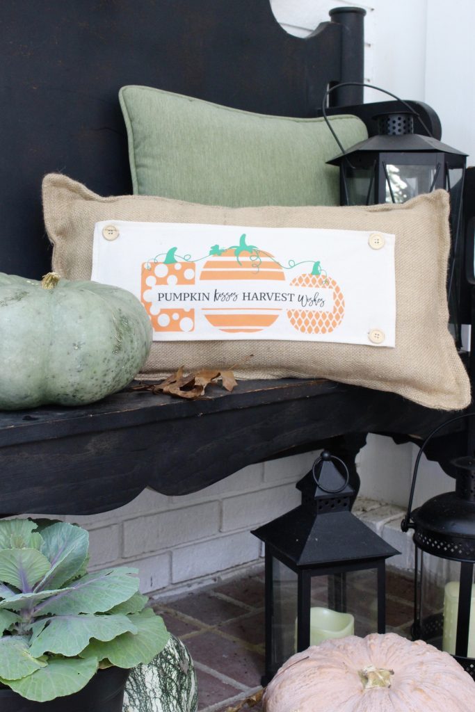 White brick ranch home- fall decor- decorating a small porch for fall- cottage home- outdoor decorating- home design- autumn decor- pumpkins- mums- front porch- handmade wreath- decorating with black and white- seasonal pillow made to use for different holidays- handmade pillow