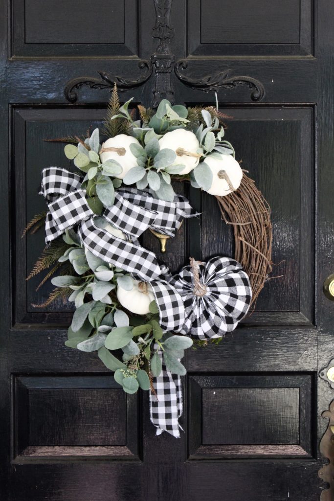 White brick ranch home- DIY wreath- fall decor- decorating a small porch for fall- cottage home- outdoor decorating- home design- autumn decor- pumpkins- mums- front porch- handmade wreath- decorating with black and white- gingham