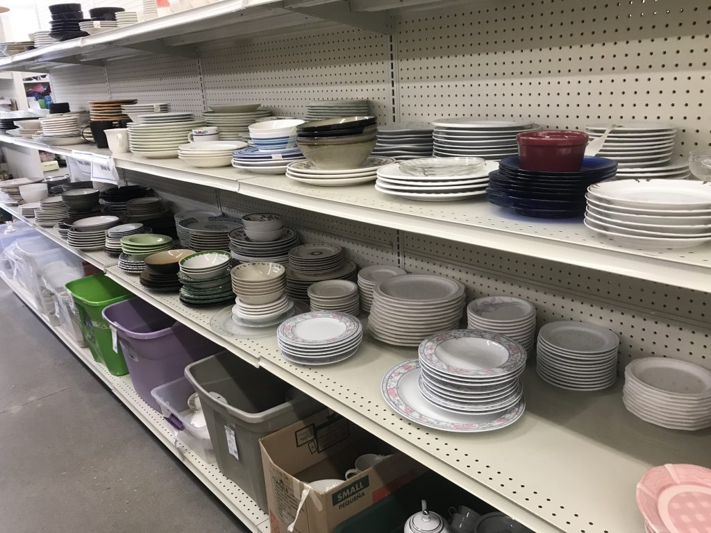 dinner sets at a thrift store 