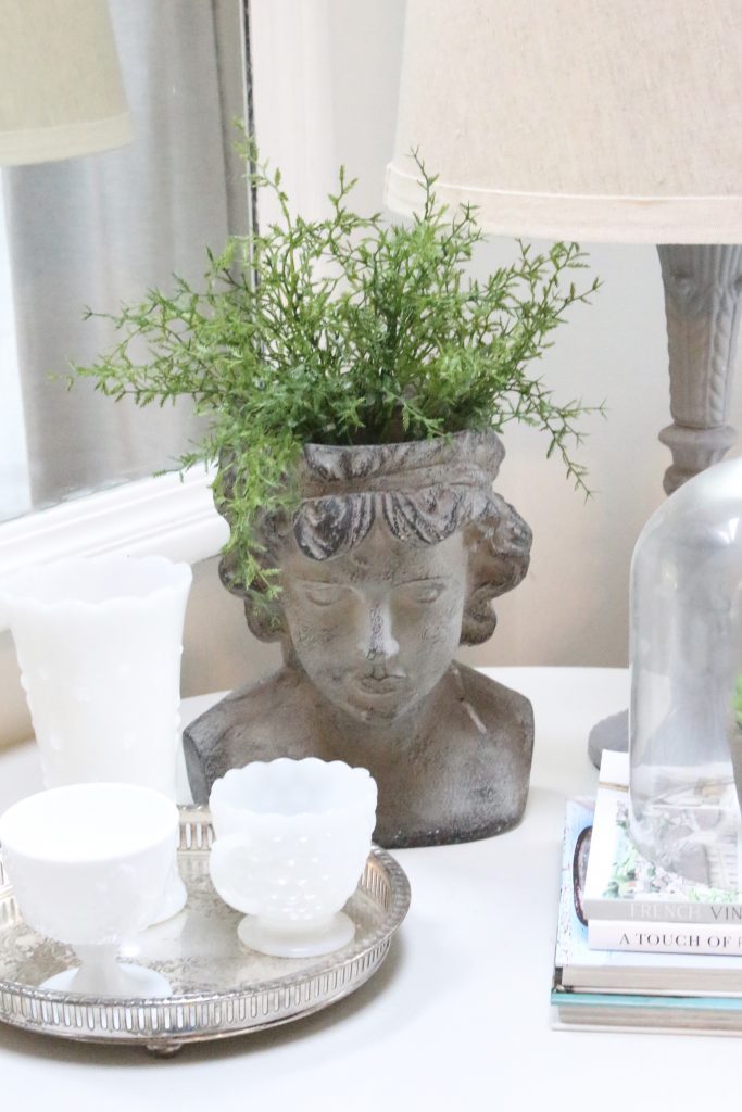spring- decor- vignette- pedestal table- milk glass- faux greenery- decorating for spring- how to decorate a corner- white decor- silver tray- vintage decor