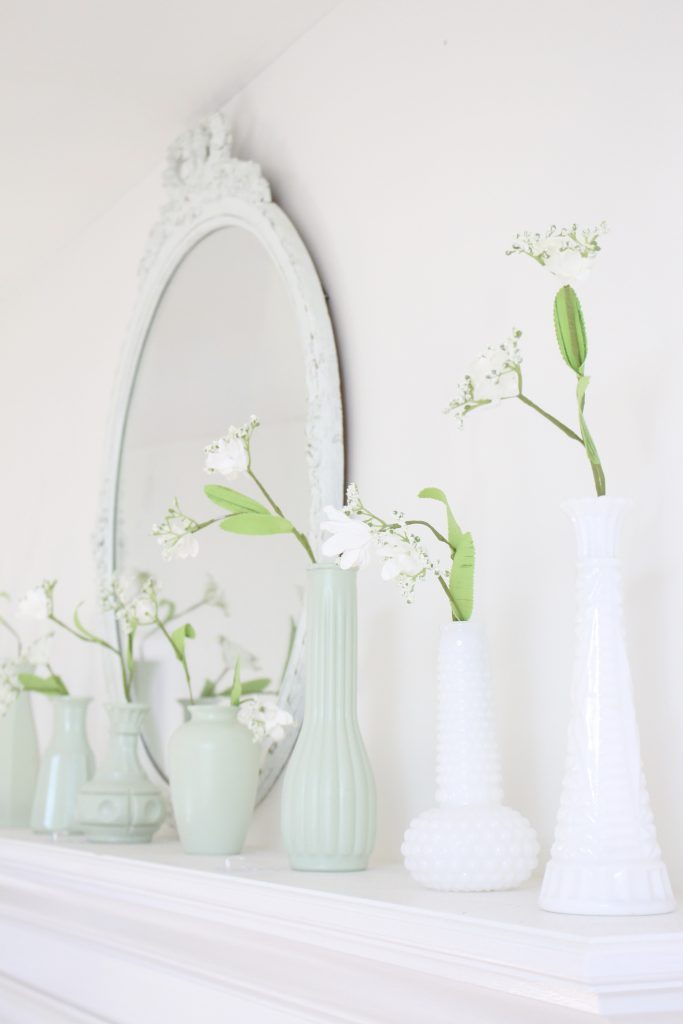 spring decor- master bedroom- spring decor- bedroom decor- bedroom-white decor- shabby chic decor- feminine decor- spring in the bedroom- floral prints- mantel decor- faux milk glass