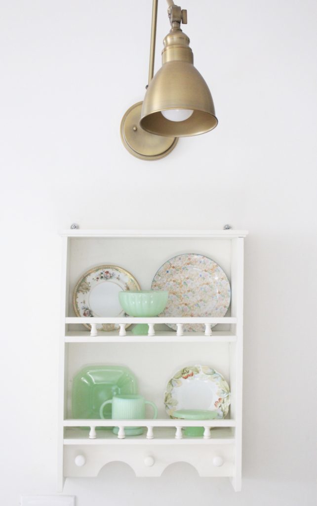 A cute little wood plate shelf- plate rack- wood shelf- jadeite- vintage china- thrifted plates- peninsula- kitchen decor- kitchen decorating- cottage kitchen decor- brass fixture
