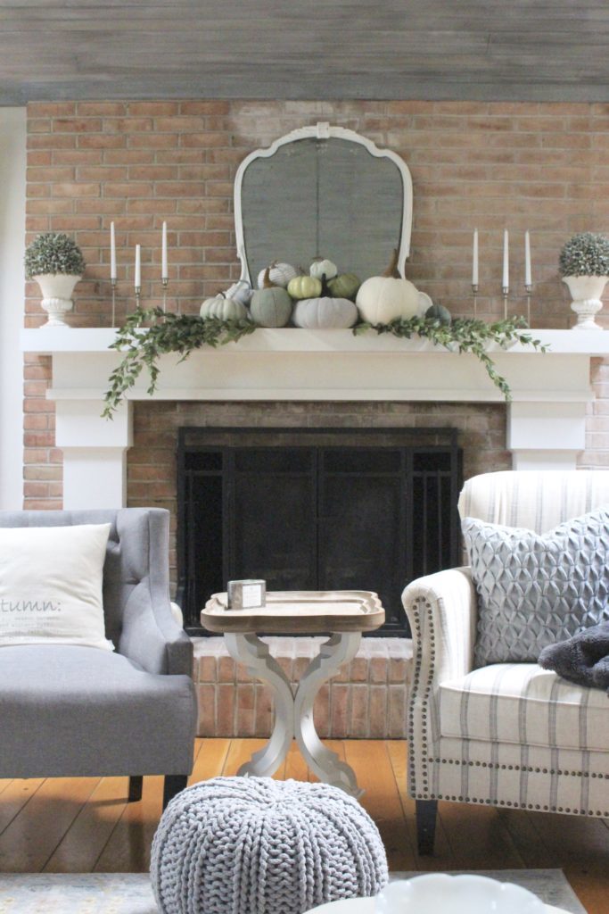 Decorating for fall with Subtle Colors- fall decor with pastel colors- pastel colors- green- gray for fall- living room fall decor- mantel decor for fall- subtle fall- simple fall decorations- pumpkin display on a mantel