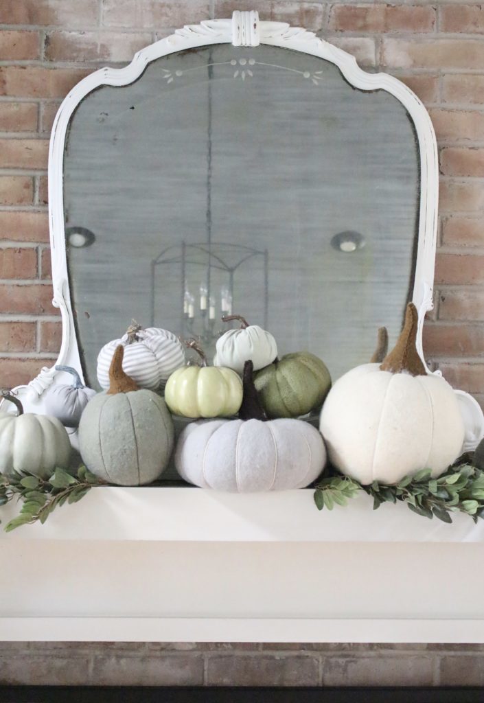 Decorating for fall with Subtle Colors- fall decor with pastel colors- pastel colors- green- gray for fall- living room fall decor- mantel decor for fall- subtle fall- simple fall decorations- pumpkins on display- wool pumpkins