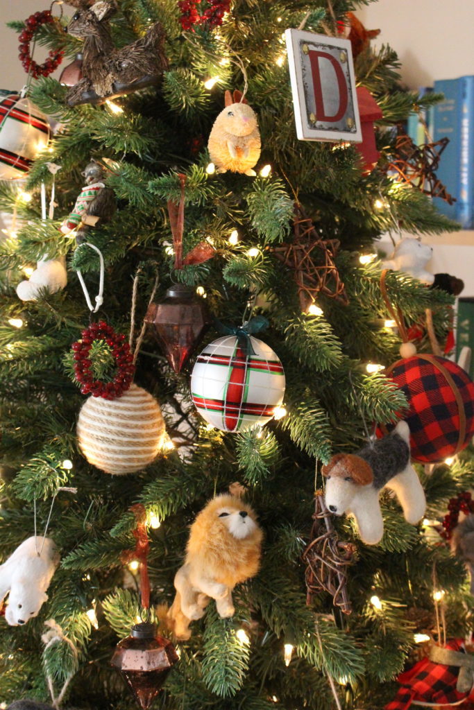 Animal Ornaments on a Christmas tree- library decor- Christmas decor in a library- animal ornaments- animal themed Christmas decor- animal ornament and decor- plaid decor- decorating a library for Christmas