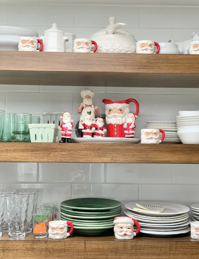 Vintage Santas displayed on our kitchen shelves- display- Santa collection- vintage Santas- Santa mugs- display- open kitchen shelving