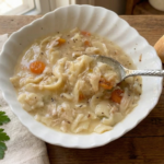 Homemade Chicken Noodle Soup in a bowl with a spoon in it