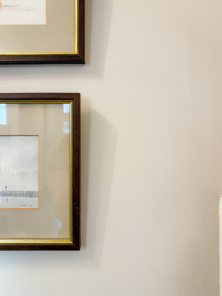 Two framed Ken Lochhead watercolours hanging on a wall painted in Valspar Goose Feathers