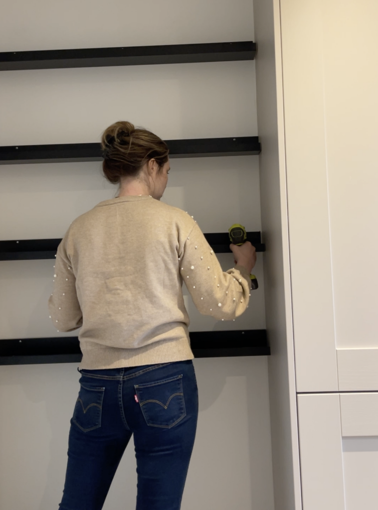 Attaching Ikea shelves to the wall in a kitchen nook