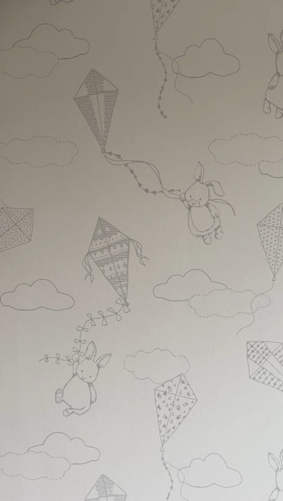 Close-up of Borastapeter Up and Away nursery wallpaper with a cute, whimsical design