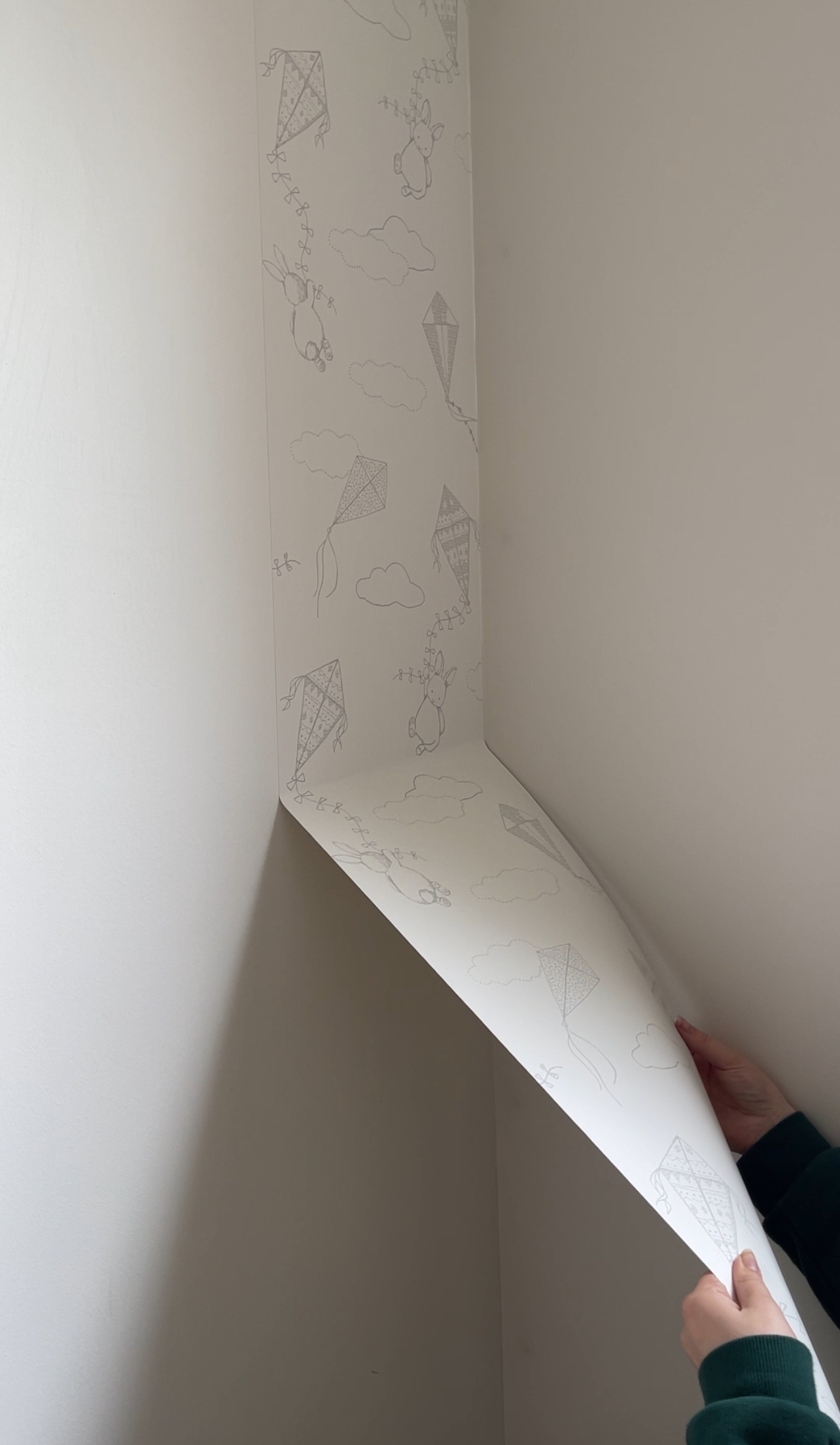 Carefully removing wallpaper from the nursery wall without damage