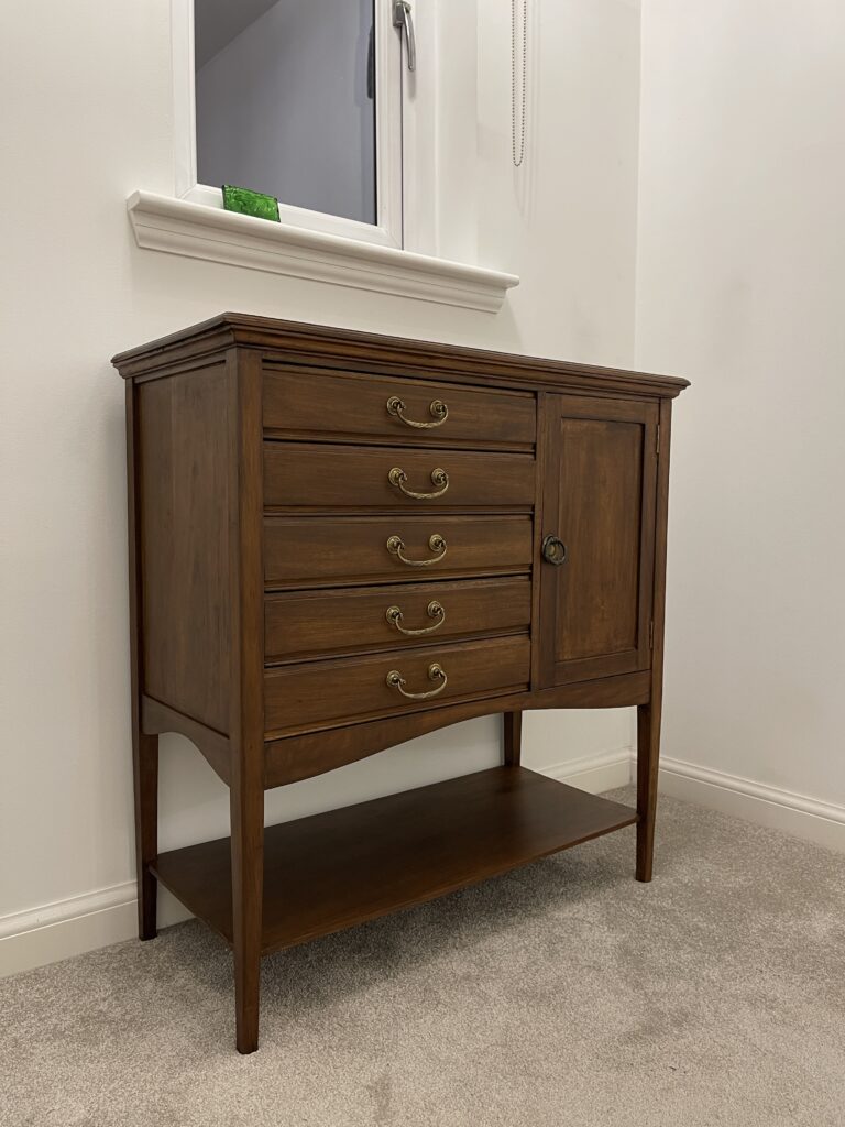 Fully restored vintage music cabinet with reattached hardware and wood finish.