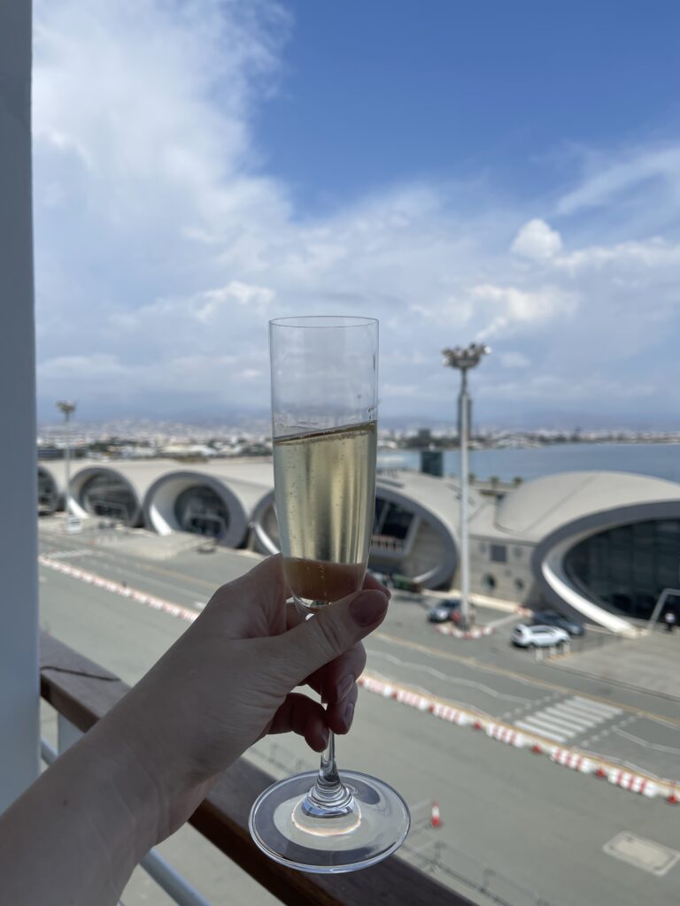 Enjoying a welcome champagne on a cruise ship balcony