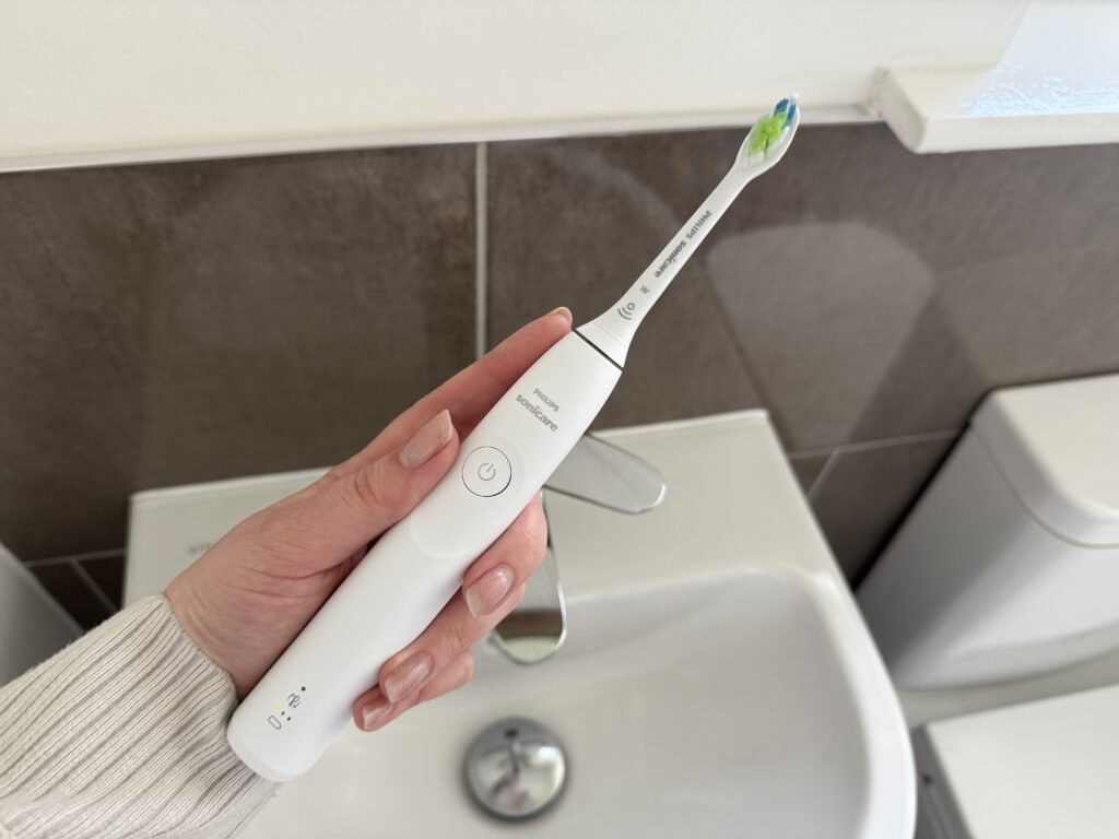 Philips Sonicare 5300 Series Electric Toothbrush being held in a hand