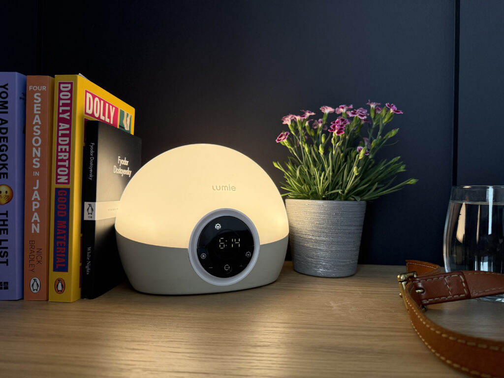 Lumie Bodyclock Spark 100 Wake-Up Light on a bedside unit in the morning