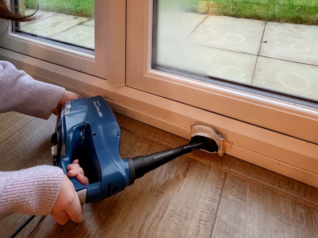 Cleaning window frames and skirting boards with the Vax Steam Fresh handheld steam cleaner