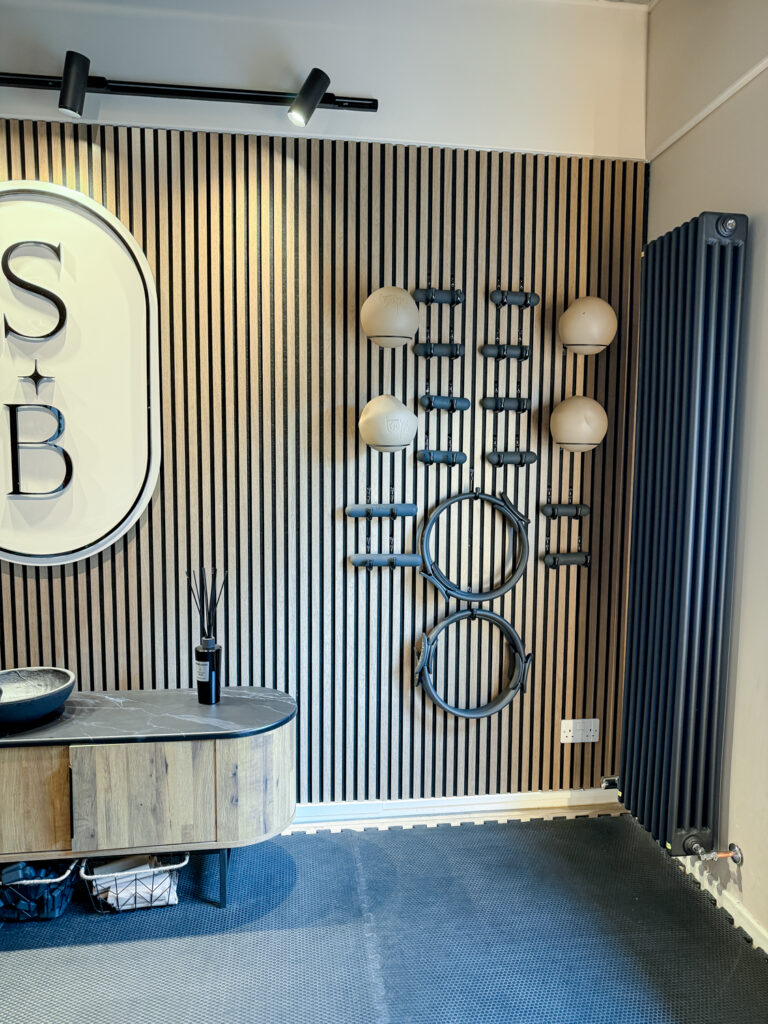 Reformer pilates weights and balls in a bright modern studio