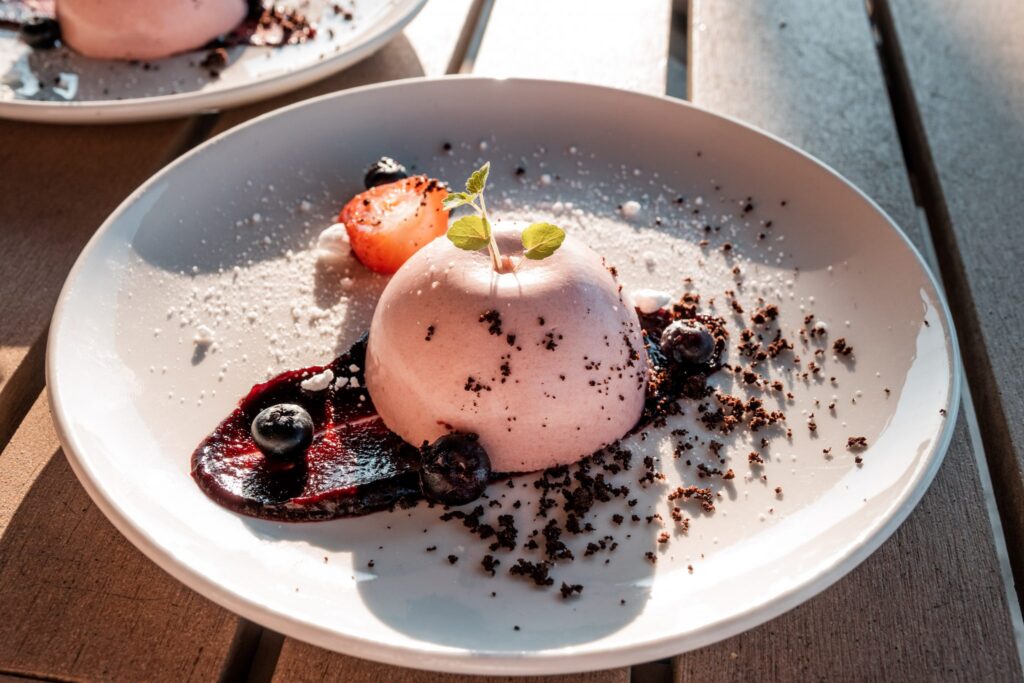 Berry panna cotta with blueberry compote and chocolate crumble, served at Waves restaurant Grand Hotel Amrath Kurhaus