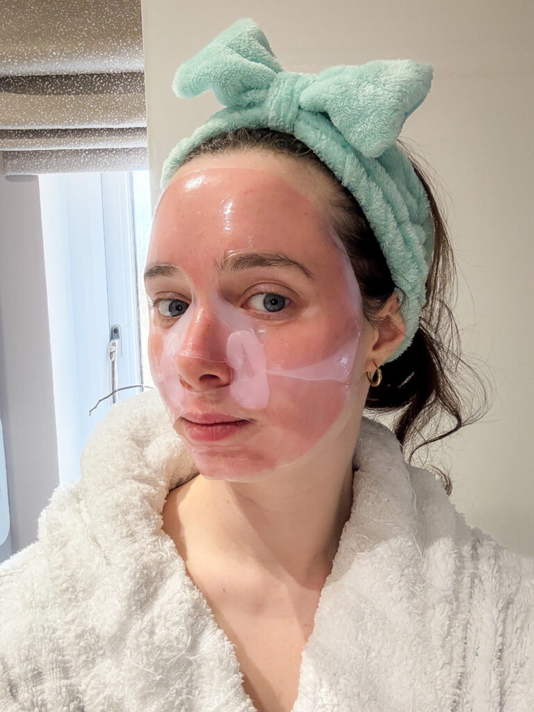 Side view of the Medicube PDRN pink collagen gel mask beginning to turn transparent after around an hour of wear