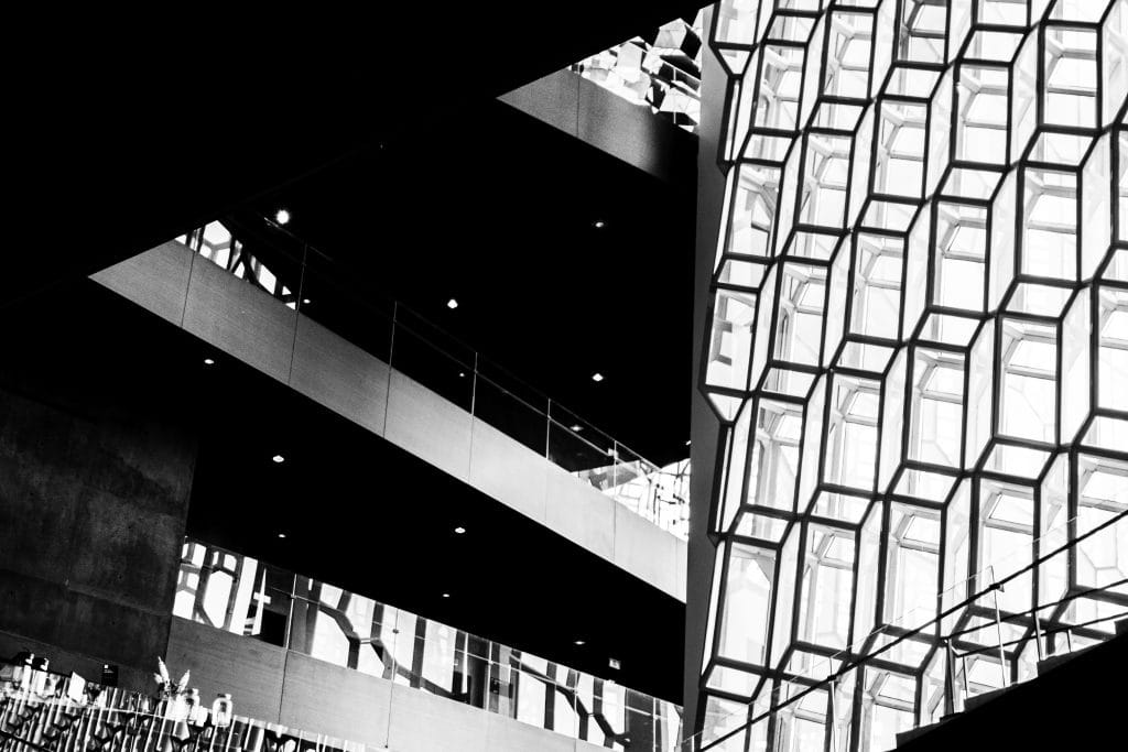 Black and white close-up of the geometric glass facade of Harpa Concert Hall, Reykjavik