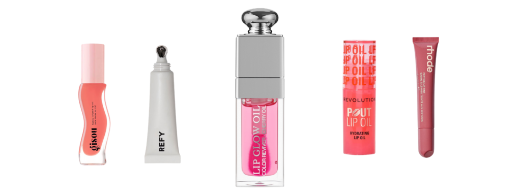 A flat lay comparison of five lip products: Gisou Honey Infused Lip Oil, Refy Lip Jelly, Dior Lip Glow Oil, Revolution Pout Lip Oil, and Rhode Peptide Lip Tint against a black background.