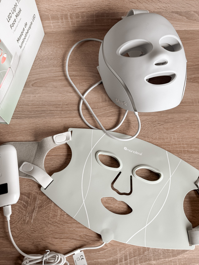 nanoleaf light therapy face mask and shark cryoglow led mask laid side by side on a counter