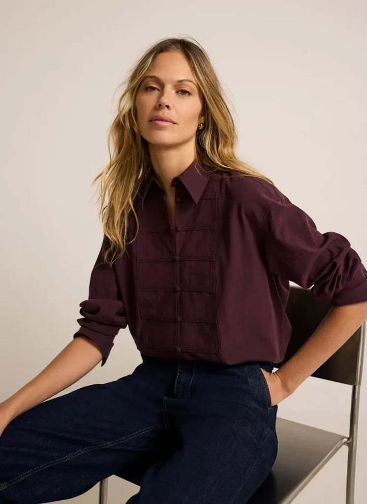 Model wearing the Mint Velvet burgundy knot-button shirt